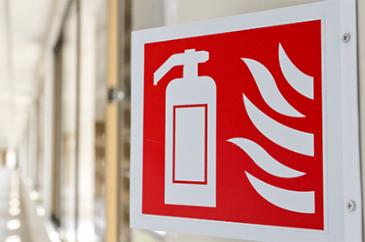 Fire Extinguisher Signage On A Building Wall Thum